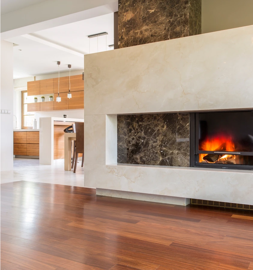 Modern home with a granite fireplace, professionally installed by Granite Gomez.